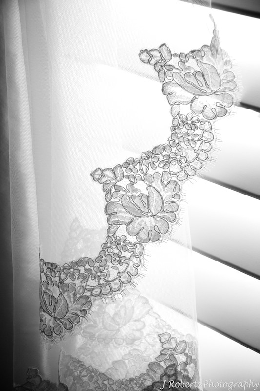 B&W photo of brides veil lace detail - wedding photography sydney